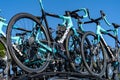 Professional road bicycles on roof of team car at a race