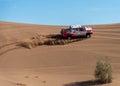Zahedan, baluchestan/iran-11/23/2018climbing sand dunes in Lut desert with a dakar edition race car