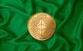 Zaire flag ethereum gold coin on flag background. The concept of blockchain bitcoin currency decentralization in the country.