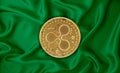 Zaire flag, ripple gold coin on flag background. The concept of blockchain, bitcoin, currency decentralization in the country. 3d-