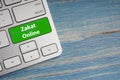 ZAKAT ONLINE text on button of computer keyboard.