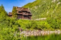 Zakopane, Poland - Crowds of tourists enjoying sunny weather and mountains scenery at the Morskie Oko pond in High Tatra Mountains