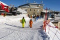 A pair of snowboarders, after taking the cable car to Kasprowy Wierch, goes towards the slope to the exit Royalty Free Stock Photo