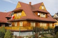 Wooden family house with a sloping tin roof