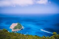 Zakynthos fantastic west coastal view with white cliff. White tourist ship sailing full speed on open azure sea water