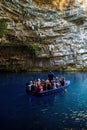 Zakynthos, Greece - Bunch of tourists on a boat in the famous melissani lake on Kefalonia island Royalty Free Stock Photo