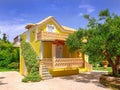 ZAKYNTHOS ISLAND, GREECE, MAY 30, 2016: Summer yellow classic Greek villa house cottage terrace for guests and tourists in amazing