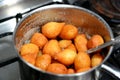 Zalabia in a stainless steel pot, a type of middle eastern fried dough similar to that of a doughnut, a tasty dessert