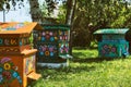 Wooden beehives decorated with painted flowers in polish village, Zalipie