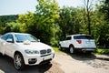 Zalischyky, Ukraine - Jule 12, 2021: Ford Explorer and BMW X6 at wedding cortege