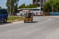 Auto rickshaw on the road in Zaliznyi port Kherson region. Tuk-tuk taxi on the street of