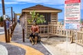 Sculpture of a pirate with a treasure chest on the beach in Zaliznyi Port. Promenade of