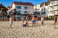 A team of young people playing volleyball on the beach in Zalizny Port Kherson region.