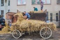 ZAMBERK, CZECHIA - SEPTEMBER 15, 2018: Threshing of grain in a wooden threshing machine in the Old Machines and Royalty Free Stock Photo