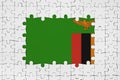 Zambia flag in frame of white puzzle pieces with missing central part Royalty Free Stock Photo