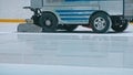 Zamboni resurfacing an indoor skating rink. Slow Motion. Ice resurfacer cleaning ice, resurfacer machine cleaning and