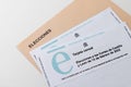 Zamora, EspaÃÂ±a - 31 de Enero de 2022: Castilla y Leon election census card February 2022 and voting envelope on white background.
