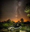 Mitsubishi Montero 4x4 vehicle at night with milky way