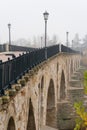 Stone bridge of Zamora and the Douro river in a foogy day