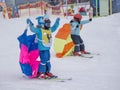 Zams, Austria - 22 Februar 2015: Active kids with safety helmet, goggles. Ski race for small children. Lesson in ski alpine school