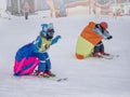 Zams, Austria - 22 Februar 2015: Child skiing in mountains. Active kids with safety helmet, goggles. Ski race for small children.