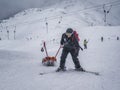 Zams, Austria - 22 Februar 2015: Mountain rescue team member with special stretcher for mountain rescuein. Safety in ski resorts