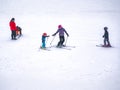 Zams, Austria - 22 Februar 2015: Ski resort. Children and adults ski on slope in Alps. Active sports vacation Royalty Free Stock Photo