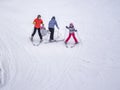Zams, Austria - 22 Februar 2015: Ski resort. A family skis on slope in Alps. Active sports vacation