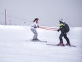 Zams, Austria - 22 Februar 2015: Ski resort. The instructor trains a women on slope in Alps. Active sports vacation