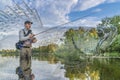 Zander fishing. Photo collage of angler in river water, fisherman catch walleye fish by spinning rod on soft focus pikeperch Royalty Free Stock Photo