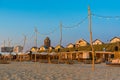 Sandy beach, cafes and houses at sunset, Zandvoort coastline,, North sea, Holland, Netherlands Royalty Free Stock Photo