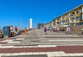 Beautiful colorful dutch north sea side promenade boulevard in coast town, waterfront homes, blue summer sky Royalty Free Stock Photo