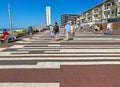 Beautiful colorful dutch north sea side promenade boulevard in coast town, waterfront homes, blue summer sky Royalty Free Stock Photo