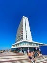 View over dutch seaside promenade on white modern north sea waterfront skyscraper, clear blue summer sky Royalty Free Stock Photo