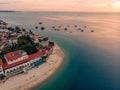 Zanzibar Aerial Shot of Stone Town Beach with Traditional Dhow Fisherman Boats in the Ocean at Sunset Time Royalty Free Stock Photo