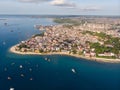 Zanzibar Aerial Shot of Stone Town Beach with Traditional Dhow Fisherman Boats in the Ocean at Sunset Time Royalty Free Stock Photo