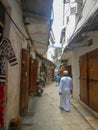 Zanzibar alley Muslim man walk Royalty Free Stock Photo