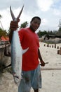 Zanzibar dark-skin fisherman holding mackerel Royalty Free Stock Photo