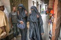 Women walking through Stone Town, Zanzibar. Tanzania Royalty Free Stock Photo