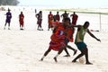Zanzibar,Masai playing soccer with tourists