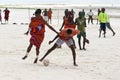 Zanzibar,Masai playing soccer with tourists