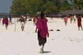 Zanzibar,Masai with typical costume walks on the beach Royalty Free Stock Photo