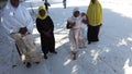 A group of African children extort money on a beach in Zanzibar, Africa.