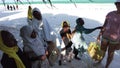 A group of African children extort money on a beach in Zanzibar, Africa.