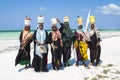 Seaweed farmers with shells and oysters in their baskets