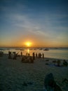 Zanzibar, Tanzania - December 3, 2019: Nungwi beach in Zanzibar, people have fun on the beach at sunset. Beautiful tropical white Royalty Free Stock Photo