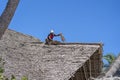 African man working on the roof of Zanzibar island, Tanzania, East Africa, close up