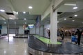 Zanzibar, Tanzania - March 14, 2023: Passengers wait for their luggage at the baggage claim belts at the ZNZ Zanzibar