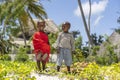 Two african masai children on the tropical beach in Zanzibar island, Tanzania, east Africa