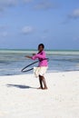 African kid playing with hula hoop on the beach Royalty Free Stock Photo